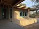 View of the partially constructed back patio with concrete block walls and window frames at 4642 W Longfellow Ave, Tampa, FL 33629