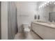 Simple bathroom with a shower, toilet and white vanity at 4306 Bayside Village Dr # 204, Tampa, FL 33615