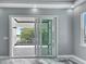 Access to the balcony from the main bedroom, with a view of the neighborhood at 534 Estuary Shore Ln, Apollo Beach, FL 33572