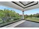 This is a beautiful balcony with glass railings and a view of the water at 534 Estuary Shore Ln, Apollo Beach, FL 33572