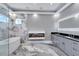 A spacious bathroom featuring a modern vanity, soaking tub, and fireplace at 534 Estuary Shore Ln, Apollo Beach, FL 33572