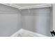 Well-organized closet with white wire shelving and trim with under-mount lighting at 534 Estuary Shore Ln, Apollo Beach, FL 33572