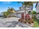 Stunning two-story home with manicured landscaping, paver driveway, and a two-car garage at 534 Estuary Shore Ln, Apollo Beach, FL 33572