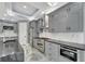 Well-equipped kitchen with stainless steel appliances, granite countertops, and custom cabinetry at 534 Estuary Shore Ln, Apollo Beach, FL 33572