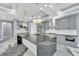 Modern kitchen featuring a large island, stainless steel appliances, and custom cabinetry at 534 Estuary Shore Ln, Apollo Beach, FL 33572