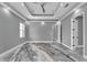 Spacious main bedroom featuring tray ceilings, recessed lighting, and gray walls at 534 Estuary Shore Ln, Apollo Beach, FL 33572