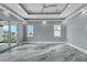 Spacious main bedroom featuring tray ceilings, recessed lighting, and gray walls at 534 Estuary Shore Ln, Apollo Beach, FL 33572