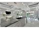 Modern kitchen with large island and high-end appliances at 548 Estuary Shore Ln, Apollo Beach, FL 33572