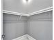 Spacious walk-in closet with ample shelving at 548 Estuary Shore Ln, Apollo Beach, FL 33572
