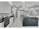 Spacious kitchen featuring a large island and dark countertops at 548 Estuary Shore Ln, Apollo Beach, FL 33572