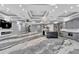 Modern kitchen with gray cabinets, large island, and high-end appliances at 534 Estuary Shore Ln, Apollo Beach, FL 33572
