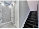 Elegant black staircase with LED lighting and modern design at 534 Estuary Shore Ln, Apollo Beach, FL 33572