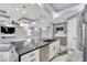 Modern kitchen with large island and stainless steel appliances at 534 Estuary Shore Ln, Apollo Beach, FL 33572