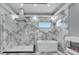 Luxurious bathroom with soaking tub, glass shower, and marble at 534 Estuary Shore Ln, Apollo Beach, FL 33572