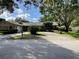 House exterior features stone accents and a well-maintained lawn at 2275 Willowbrook Dr, Clearwater, FL 33764