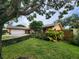 Ranch-style house with attached garage and manicured lawn at 2275 Willowbrook Dr, Clearwater, FL 33764