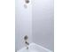 Bathroom with white hexagonal tile and a bathtub at 213 W Giddens Ave, Tampa, FL 33603