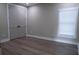Bedroom with hardwood floors and double doors at 213 W Giddens Ave, Tampa, FL 33603