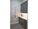 Features a stylish butler's pantry with wine storage, elegant countertops, and decorative wall art at 213 W Giddens Ave, Tampa, FL 33603