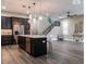 Open kitchen featuring a spacious island, stainless steel appliances, and stylish pendant lighting at 213 W Giddens Ave, Tampa, FL 33603