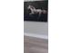 Living room featuring hardwood floors and large artwork at 213 W Giddens Ave, Tampa, FL 33603