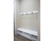 Mudroom features a built-in bench with storage and coat hooks for organization at 213 W Giddens Ave, Tampa, FL 33603