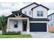 Two-story craftsman style home with gray siding at 213 W Giddens Ave, Tampa, FL 33603