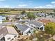 Aerial view of home with landscaped yard at 1830 E Del Webb Blvd, Sun City Center, FL 33573