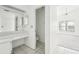 Simple bathroom with a vanity, toilet, and access to a bedroom at 1830 E Del Webb Blvd, Sun City Center, FL 33573