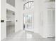 Bright and airy foyer with tiled floors and a view into the living area at 1830 E Del Webb Blvd, Sun City Center, FL 33573