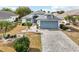 Single-story home with light blue garage door at 1830 E Del Webb Blvd, Sun City Center, FL 33573