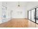 Bright living room with hardwood floors and sliding glass doors at 1830 E Del Webb Blvd, Sun City Center, FL 33573