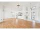 Open living room with a view of the kitchen and entryway at 1830 E Del Webb Blvd, Sun City Center, FL 33573
