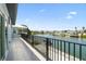 Balcony overlooking the waterfront offers peaceful outdoor living with views of the canal and homes at 3171 Sea Grape Dr, Hernando Beach, FL 34607