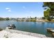 Scenic waterfront view showcases the serene canal with multiple docks and charming waterfront homes at 3171 Sea Grape Dr, Hernando Beach, FL 34607