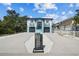 Two-story home featuring a dual-entry design, modern mailbox, and light blue and white color scheme at 3351 Fernleaf Dr, Hernando Beach, FL 34607
