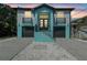 Two-story home featuring a dual-entry design with black garage doors and matching railings at 3351 Fernleaf Dr, Hernando Beach, FL 34607