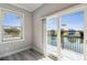 Room with balcony showcasing water views and sliding glass doors at 3380 Holly Springs Dr, Hernando Beach, FL 34607