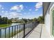 Waterfront home with a balcony overlooking the tranquil lake and a private community at 3380 Holly Springs Dr, Hernando Beach, FL 34607