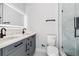 Modern bathroom featuring double sinks, elegant fixtures, and a glass-enclosed shower at 3380 Holly Springs Dr, Hernando Beach, FL 34607