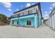 Multi-level waterfront home with a large balcony and ground-floor patio area at 3380 Holly Springs Dr, Hernando Beach, FL 34607