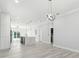 Open-concept living space featuring a large kitchen island with pendant lighting at 3380 Holly Springs Dr, Hernando Beach, FL 34607