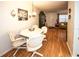 Small dining area with a round table and four white chairs at 4746 Azalea Dr # 109, New Port Richey, FL 34652