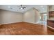 Spacious living room with vaulted ceilings and wood-look floors at 33040 Darby Trails, Dade City, FL 33525