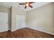 Bedroom with double doors leading to closet and wood-look floors at 33040 Darby Trails, Dade City, FL 33525