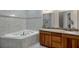 Elegant bathroom with double vanity, soaking tub and tile at 33040 Darby Trails, Dade City, FL 33525