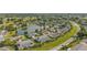 Community overview showcasing homes and a scenic pond at 2410 Lancaster Dr, Sun City Center, FL 33573