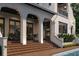 A charming outdoor patio with brick steps and columns offers a relaxing seating area at 5009 W Spring Lake Dr, Tampa, FL 33629