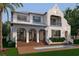 Luxurious home boasting a manicured lawn, swimming pool, and well-designed exterior features at 5009 W Spring Lake Dr, Tampa, FL 33629