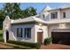 View of the house from the front yard, highlighting the architecture and elegant facade at 5009 W Spring Lake Dr, Tampa, FL 33629